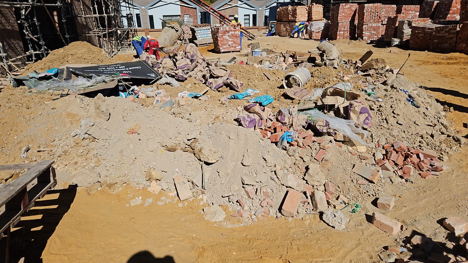 Rubble and building material piled at a residential construction site
